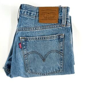 Women’s Levi’s premium denim jeans with butterfly buttons.